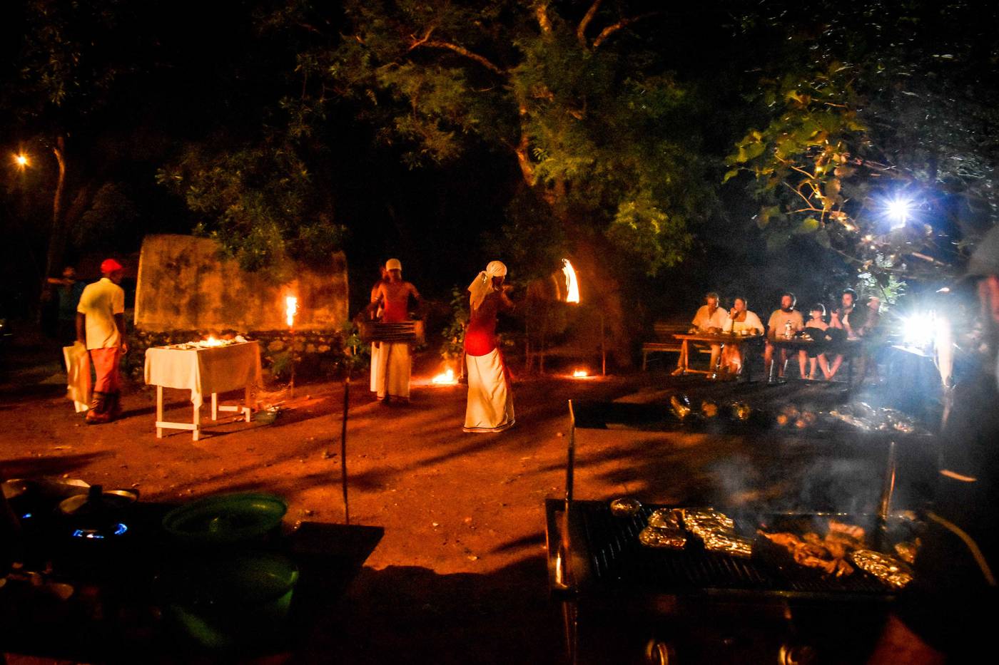 Fire dancer performing during Hambu Café's traditional evening ceremony