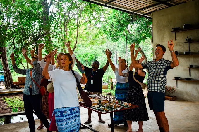 A tour group enjoying the Ceylon tea tasting experience at Hambu Café