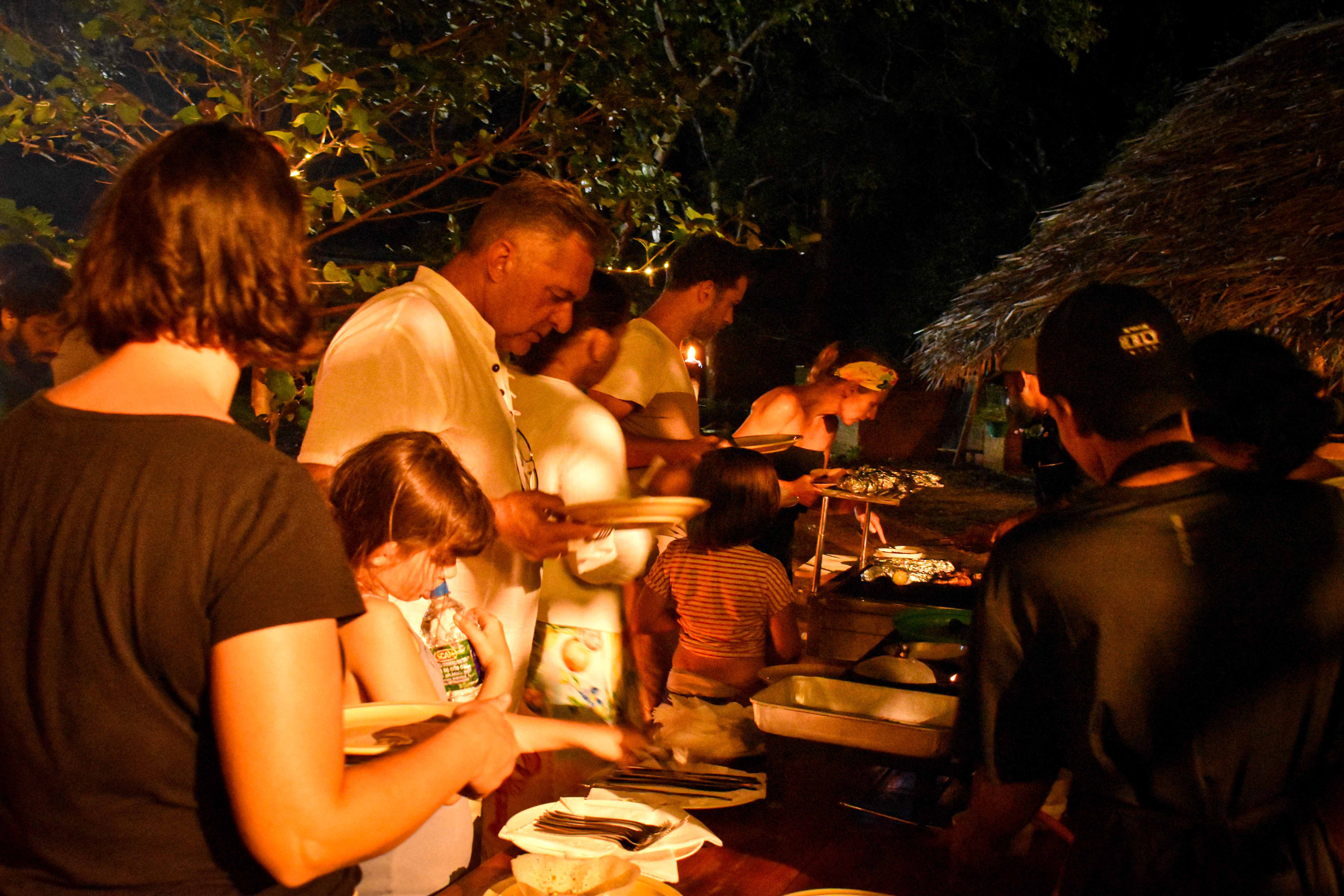 Guests enjoying a traditional buffet dinner