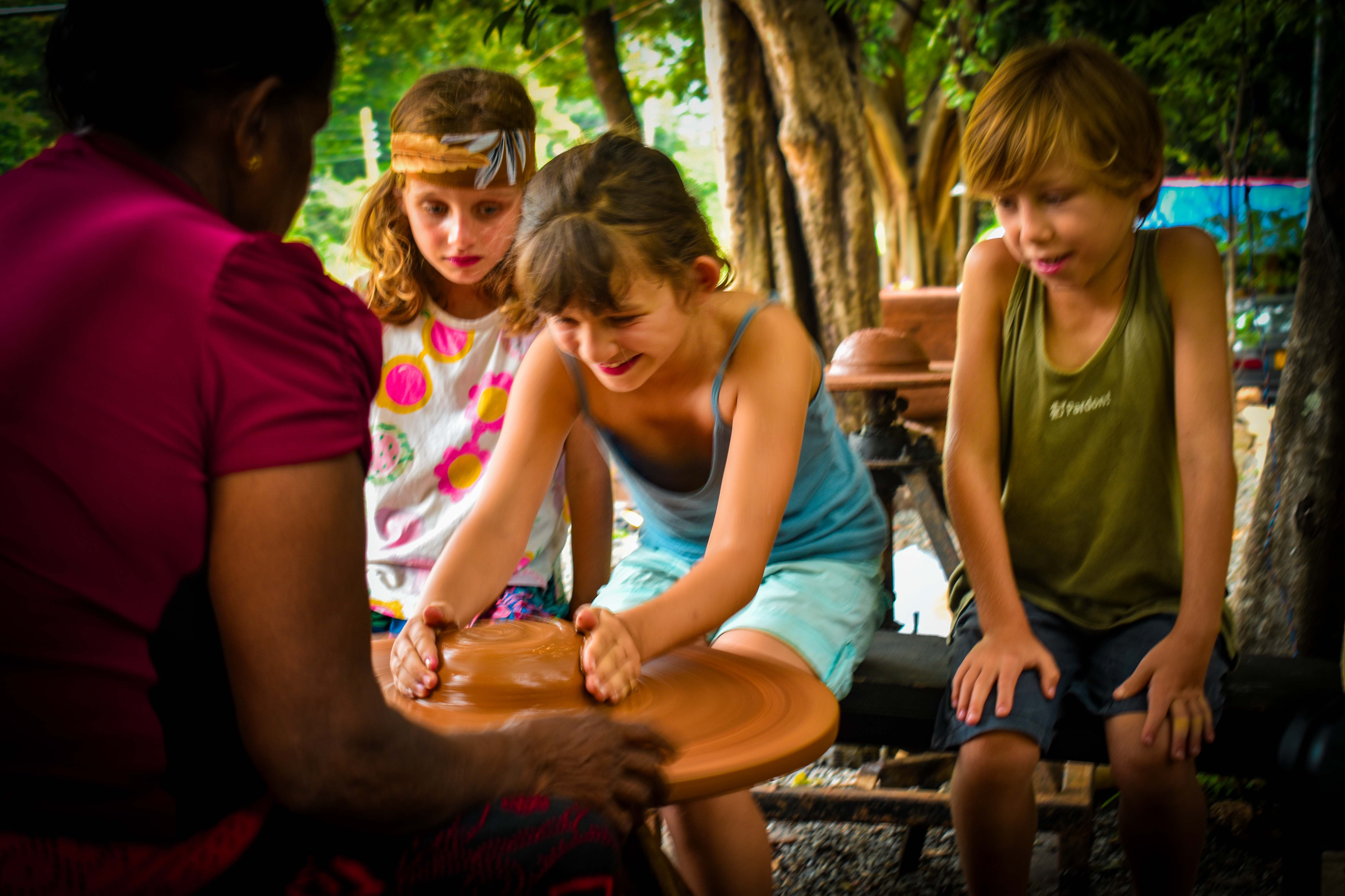 Children engaged in a pottery workshop